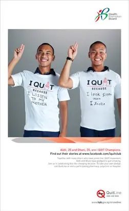 A photo of two young people wearing I Quit t-shirts and holding up two fingers of their right hands